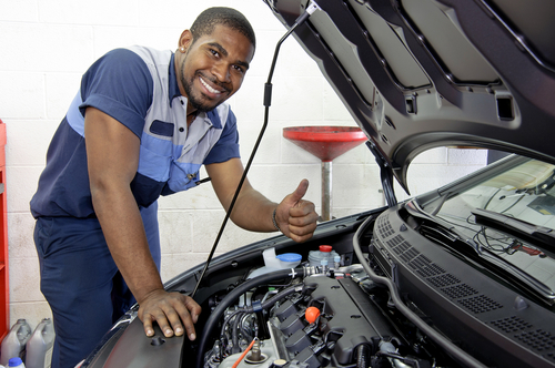 Good,looking,mechanic,giving,thumbs,up,and,smiling